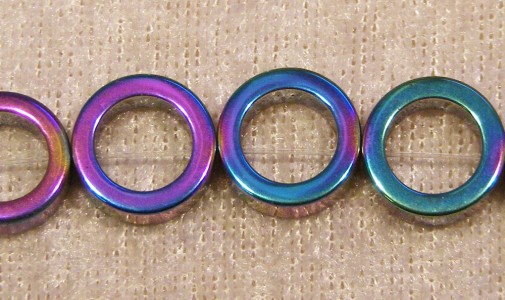 Ringar i hematit, 12x12x4 mm, elektropläterade i regnbågsfärg