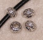 Mellandel m stort hål, mönstrad rondell, antiksilver