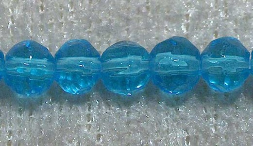 Facetterad rund kristallpärla, Turkos, 4 mm