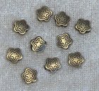 Mellandel, blommönstrad blomma, antikbrons