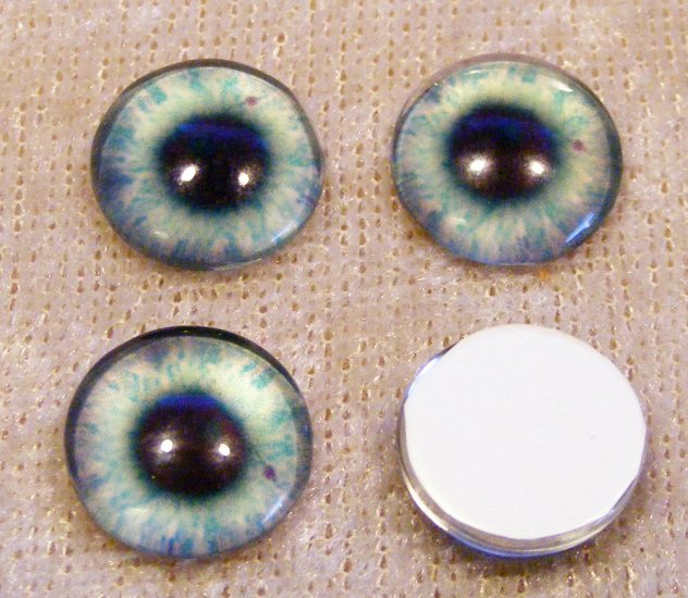 Ögoncabochoner, glas, blå/grå/turkos, 12mm rund - Klicka på bilden för att stänga