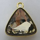 Triangulär berlock med champagnefärgad strass