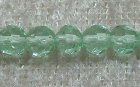 Facetterad rund kristallpärla, Ljusgrön, 4 mm