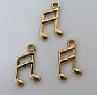 Berlock, noter, antikguldfärgad