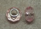 Facetterad transparent rosa glasrondell m stort silverfärgat hål