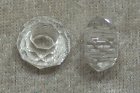 Facetterad transparent glasrondell med stort hål