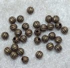 Melonpärlor, antikbrons, 5 mm