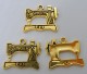 Berlock, symaskin, antikguld