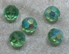 Facetterad rund kristallpärla, Ljusgrön AB, 12 mm