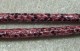 Konstläderrem, ormskinnsmönstrad fuchsia/svart, 7 mm, med stoppn