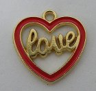 Berlock, liten hjärtram i guldfärg m röd emalj