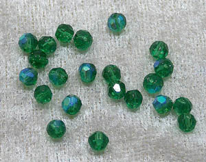 Facetterad rund kristallpärla, Mörkgrön AB, 4 mm - Klicka på bilden för att stänga