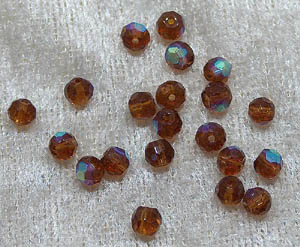 Facetterad rund kristallpärla, Mörkbrun AB, 4 mm - Klicka på bilden för att stänga