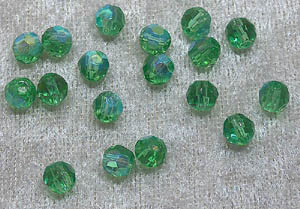 Facetterad rund kristallpärla, Grön AB, 6 mm - Klicka på bilden för att stänga