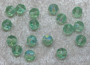 Facetterad rund kristallpärla, Ljusgrön AB, 6 mm - Klicka på bilden för att stänga