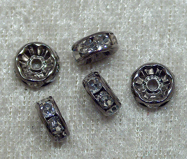 Strassmellandel, svart rondell, transparenta stenar, 8 mm - Klicka på bilden för att stänga